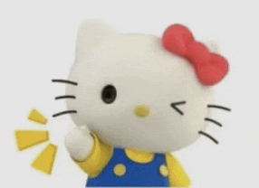 a hello kitty doll with a red bow on her head