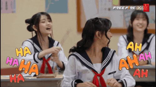 three girls in school uniforms are laughing in a classroom with free fire x written on the bottom