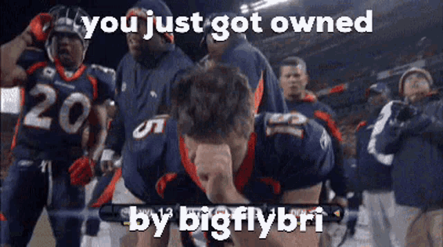 a football player with the number 20 on his jersey is kneeling down