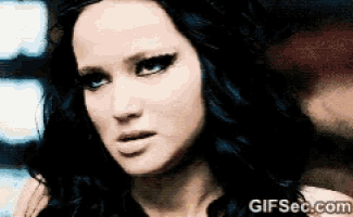 a close up of a woman 's face with the website gifsec.com visible