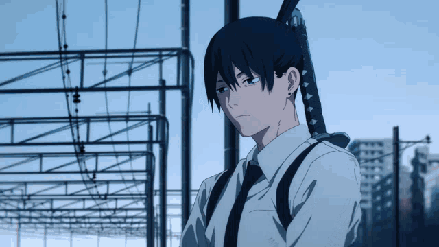 a man in a white shirt and tie is holding a sword in his right hand