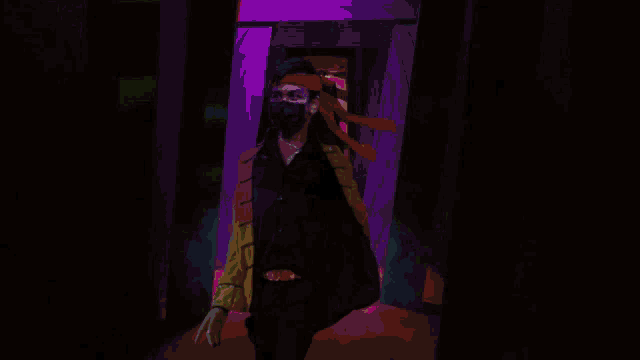 a man wearing a black mask and a red headband