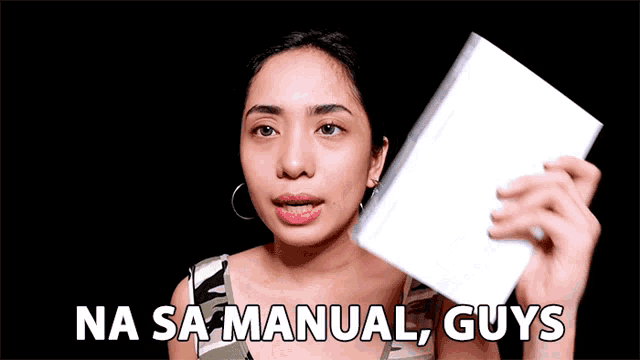 a woman is holding a piece of paper and the words na sa manual guys are above her
