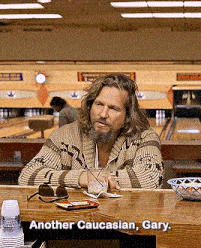 a man sitting at a bowling alley with the words another caucasian gary