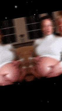 a blurry picture of a woman 's face is displayed on a screen