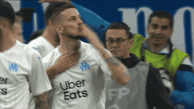 a soccer player wearing an uber eats jersey