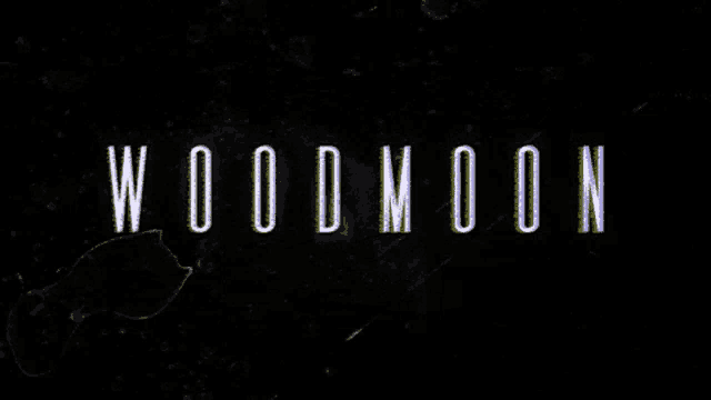 a black background with the word woodmoon written on it