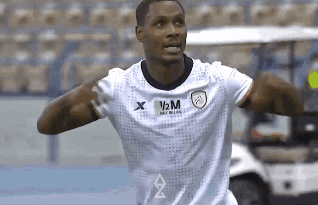 a soccer player wearing a shirt that says 1/2 million on it