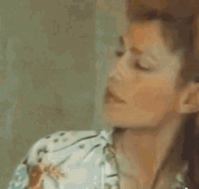 a close up of a woman 's face with the word look on the bottom