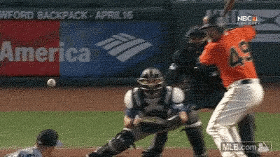 a baseball player wearing number 49 is swinging at a pitch