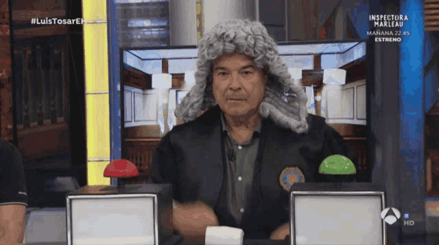 a man wearing a wig is on a tv show called inspector marleau