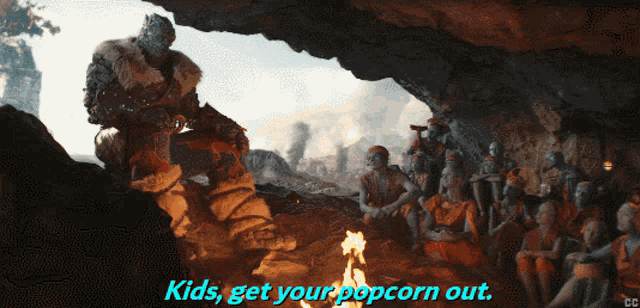 a group of people sitting around a fire with the words kids get your popcorn out below them