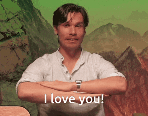 a man with his arms crossed and the words i love you behind him