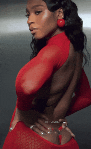 a woman in a red dress has the word dopamine written on the bottom