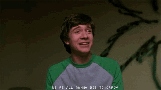 a man in a green and white shirt says we 're all gonna die tomorrow