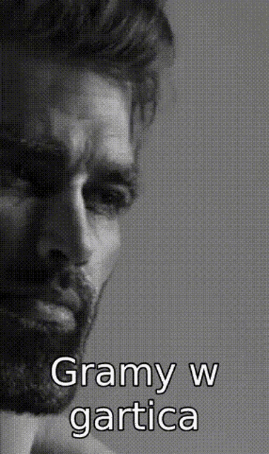 a black and white photo of a man with the words gramy w gartica above him