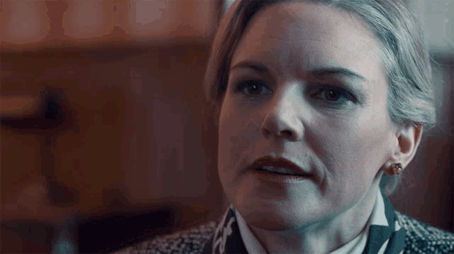 a woman with a serious look on her face