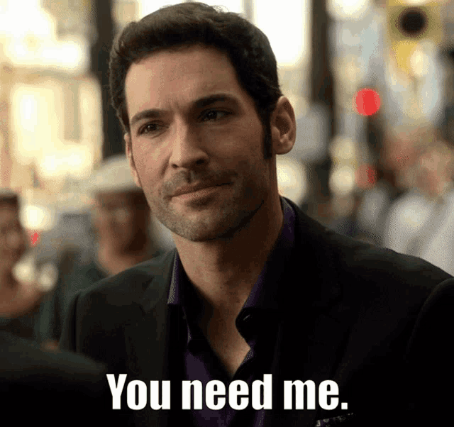 a man in a suit and a purple shirt says you need me