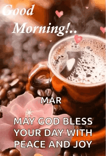 a cup of coffee is sitting on top of a table next to a flower .