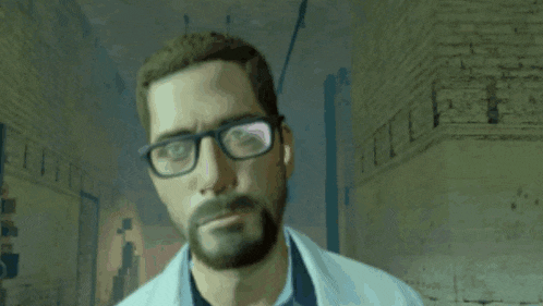 a man with glasses and a beard is smiling in a room .