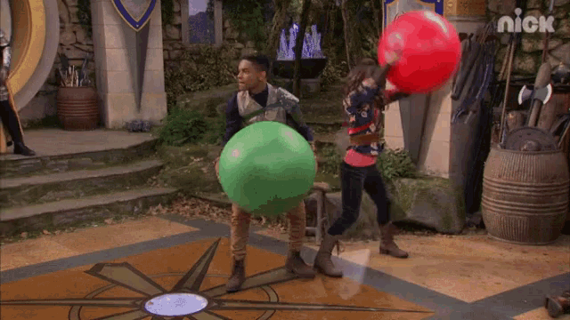 a boy and a girl are playing with balloons in a scene from a nick show
