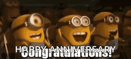 a group of minions are standing next to each other .