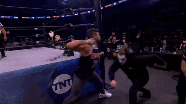 a wrestling ring with a tnt logo on the side of it