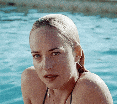 a close up of a woman 's face in a pool