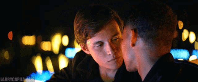 a couple of men looking at each other with larrycapua.org written in the bottom right corner