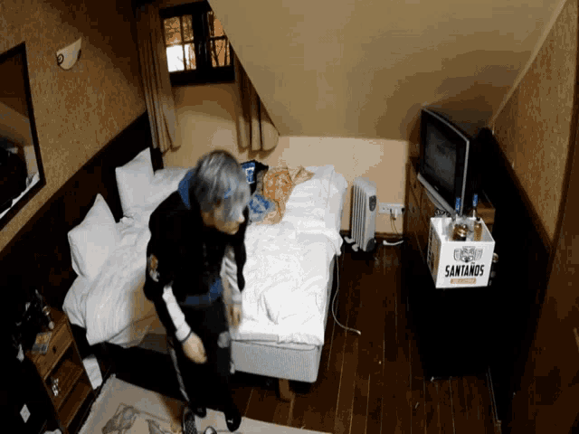 a box of santanos beer sits on a table in a bedroom