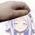 a close up of a person 's hand touching a girl 's forehead .