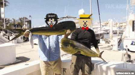 two men holding a fish with one wearing a hat that says " idiot "