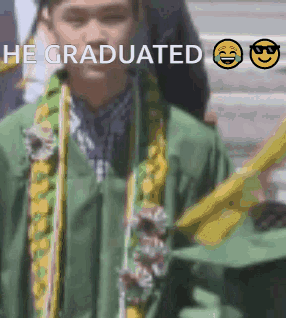 a young man in a graduation cap and gown with the caption he graduated