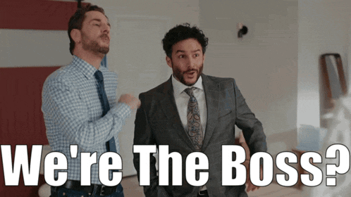 two men standing next to each other with the words " we 're the boss " behind them