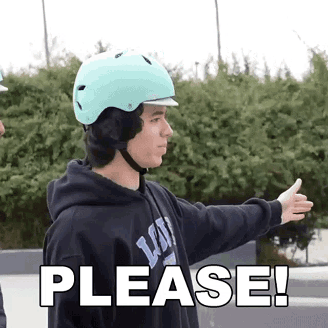 a man wearing a helmet and a hoodie with the word please below him