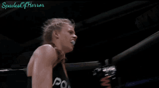 a woman in a boxing ring with the words spades of horror written on the bottom