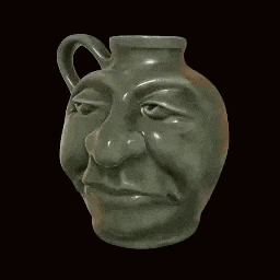 a green ceramic pitcher with a face on it is smiling on a black background .