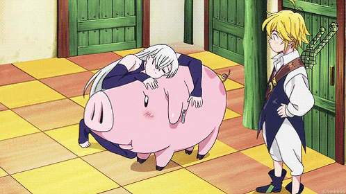 a girl laying on a pig while a boy stands behind her