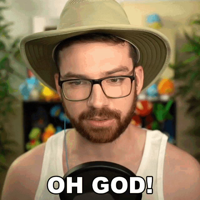 a man wearing a hat and glasses is saying oh god