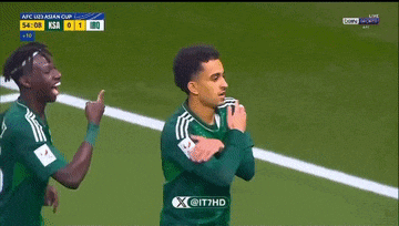 two soccer players are celebrating a goal on a soccer field sponsored by it7hd