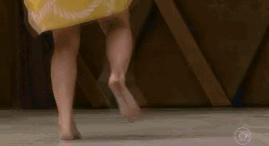 a woman is wearing a yellow skirt with a compass on it