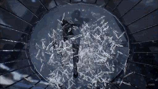 a person is in a cage with a lot of pieces of glass