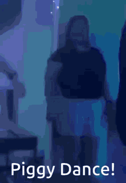 a woman is dancing in a dark room with the words piggy dance written below her .