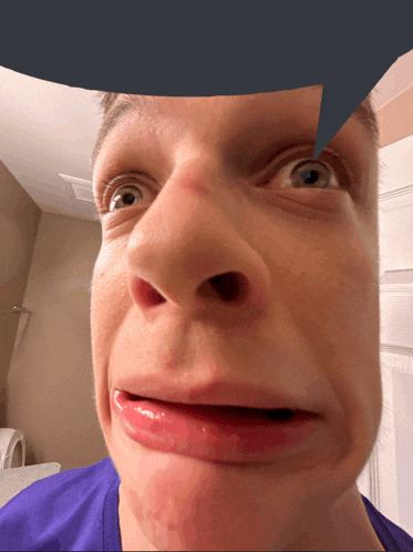 a close up of a man 's face with a speech bubble over his head