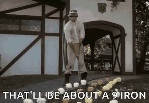 a man is standing next to a bunch of flowers with the words that 'll be about a 9 iron below him