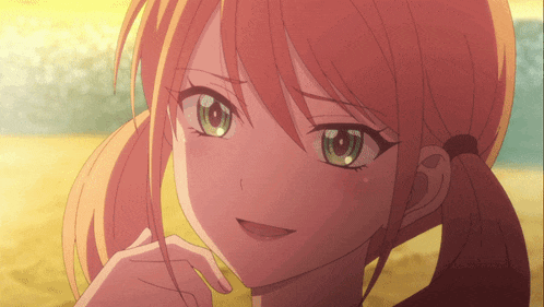 a close up of a girl 's face with a ponytail and green eyes