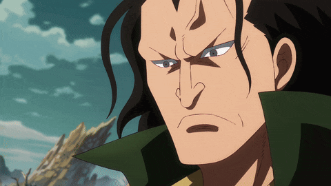 a close up of a man 's face with long hair and a green collar