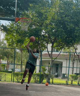 a man is playing basketball on a court