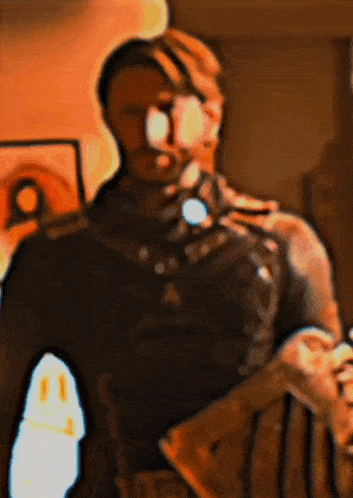 a blurry picture of a man in a military uniform holding a gun