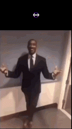 a man in a suit is dancing in a hallway